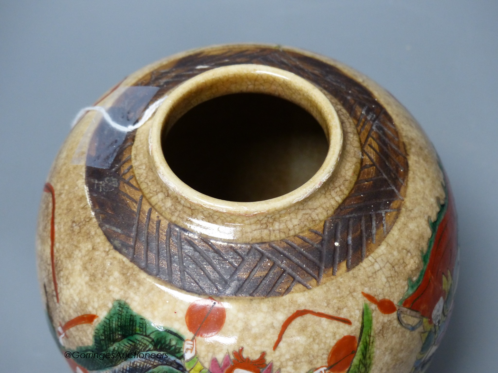 An early 20th century Chinese famille rose crackle glaze jar and cover, 20cm high